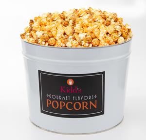 Buy luxury gourmet popcorn in our white and black medium 2 gallon tin filled with sweet mouthwatering caramel popcorn, cheddar cheese and white cheddar flavors. 