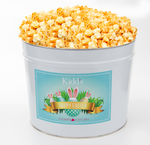Load image into Gallery viewer, mouthwatering Cheesy Cheddar and White Cheddar Gourmet Popcorn in a Deliverable Rabbit and Easter Egg Popcorn Bucket.
