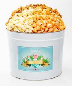 medium basket gift popcorn for easter. filled with savory, cheesy cheddar, white cheddar and sweet caramel popcorn.