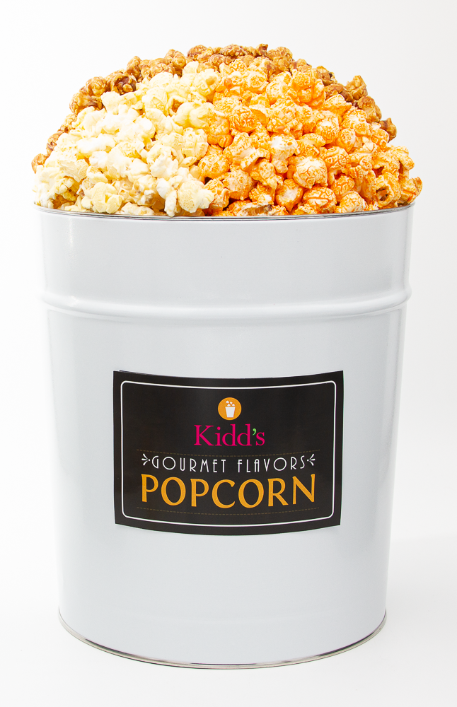 Popcorn in Gourmet Flavors in large white 3.5 gallon tin. Includes our best flavors sweet caramel, decadent white cheddar and sharp cheddar cheese. 