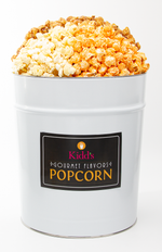 Load image into Gallery viewer, Popcorn in Gourmet Flavors in large white 3.5 gallon tin. Includes our best flavors sweet caramel, decadent white cheddar and sharp cheddar cheese. 
