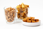 Load image into Gallery viewer, caramel popcorn and peanuts displayed in clear cups
