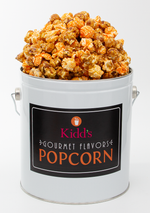 Load image into Gallery viewer, Chicago Style Gourmet popcorn in famous caramel and cheese mix. Our classic black and white 1 gallon popcorn tin makes a great gift tin for anybody.
