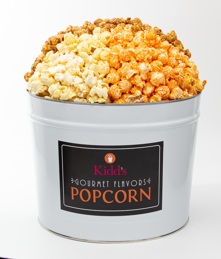Kidd's Pop Shop Assorted Tin is a Christmas favorite. It's filled with our top three flavors. Cheesy Cheddar popcorn, the best caramel popcorn and white cheddar. All tins are fresh and quality tested before shipment and delivery. Order online and ship anywhere in united states. 50% off