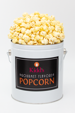 Load image into Gallery viewer, White cheddar flavored popcorn in small white and black popcorn can.
